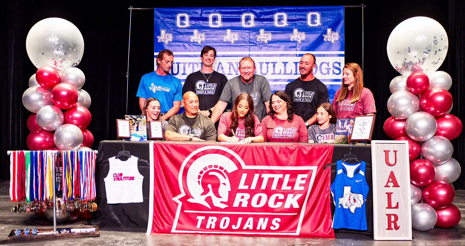 Attending Brooklyn Marcee’s college signing for UA-Little Rock last week were, back row from left, coaches: Toby Howell (private pole-vault), Blake Hamrick (track), Shane Webber (AD), Devin Shaw (hurdles) and Ashlee Lingo (volleyball, 6 years); and, front row, sister Addison, dad Andy, Brooklyn, mom Heather and sister Cooper.